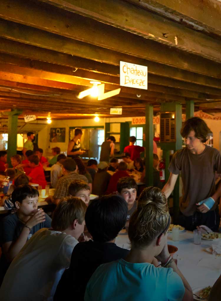 Campers eating dinner together