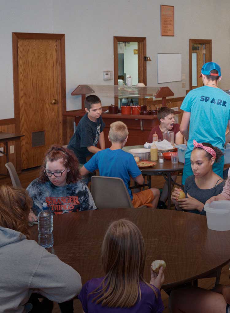 Campers eating breakfast